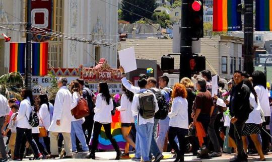 UCSF community members march in demostration througjh the Catro district in San Francisco